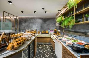 a buffet line with many different types of food at Occidental Alicante in Alicante