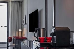 A television and/or entertainment centre at Radisson RED Danang