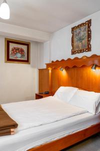 Postel nebo postele na pokoji v ubytování Hotel La Posada de Atahualpa