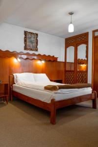 Postel nebo postele na pokoji v ubytování Hotel La Posada de Atahualpa