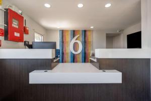 an office with a desk with a number six sign at Motel 6 Fort Worth, TX East in Fort Worth