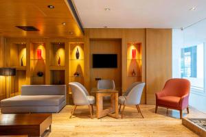A television and/or entertainment centre at Svelte Delhi, a member of Radisson Individuals