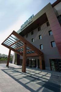 a building with a sign on top of it at AS Hotel Limbiate Fiera in Limbiate