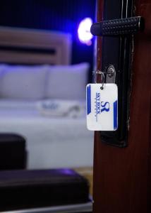 Letto o letti in una camera di Skyrock Hotels Ikeja