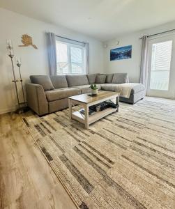 a living room with a couch and a coffee table at Easystay in Fairbanks