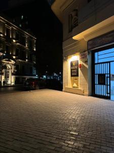 a building with a sign on the side of it at night at Cairo Dream Boutique Hotel in Cairo +24 photos