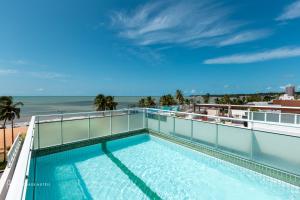 A piscina localizada em Rede Andrade Solmar ou nos arredores