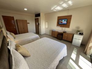 Ένα ή περισσότερα κρεβάτια σε δωμάτιο στο Darling Hotel Ciudad del Este