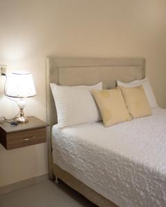 Ένα ή περισσότερα κρεβάτια σε δωμάτιο στο Darling Hotel Ciudad del Este