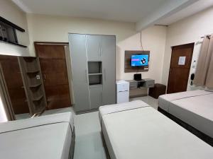 Μια τηλεόραση ή/και κέντρο ψυχαγωγίας στο Darling Hotel Ciudad del Este