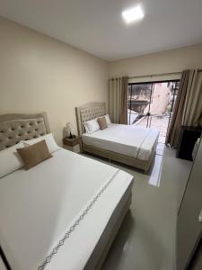 Postel nebo postele na pokoji v ubytování Darling Hotel Ciudad del Este