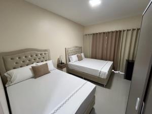 Ένα ή περισσότερα κρεβάτια σε δωμάτιο στο Darling Hotel Ciudad del Este