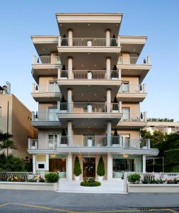 a large building with balconies on the side of it at Hotel Gala in Riccione