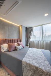 Postel nebo postele na pokoji v ubytování Hotel Glow Medellín