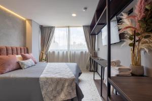 Postel nebo postele na pokoji v ubytování Hotel Glow Medellín