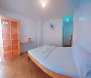 Postel nebo postele na pokoji v ubytování Camotes Hostel Resort