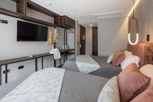 Postel nebo postele na pokoji v ubytování Hotel Glow Medellín