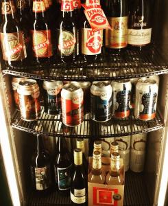 a refrigerator filled with lots of bottles of beer at Spillover Motel and Inn in Stratton