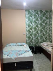 Postel nebo postele na pokoji v ubytování KitNet com cozinha e ar