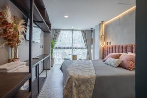 Postel nebo postele na pokoji v ubytování Glow Medellín