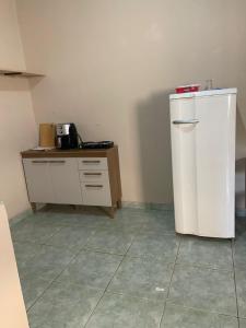 Kuchyň nebo kuchyňský kout v ubytování KitNet com cozinha e ar