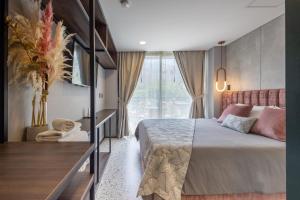 Postel nebo postele na pokoji v ubytování Hotel Glow Medellín