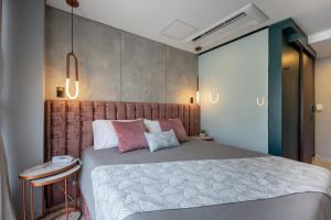 Postel nebo postele na pokoji v ubytování Hotel Glow Medellín