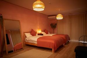 Postel nebo postele na pokoji v ubytování 一棟貸し別荘 mitt house inn