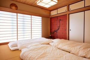 Postel nebo postele na pokoji v ubytování 一棟貸し別荘 mitt house inn + 37 fotografií