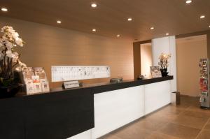 A kitchen or kitchenette at AS Hotel Limbiate Fiera