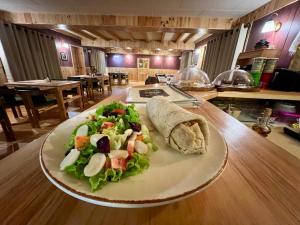 a plate of salad and a slice of bread on a table at Namche Terrace in Namche