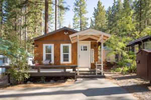 a tiny house in the woods with a picnic table at The Brook Ave Bungalow in Kings Beach