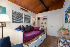a living room with a couch in a room at The Brook Ave Bungalow in Kings Beach