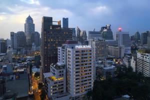 a view of a city skyline with a tall building at PARKROYAL Suites Bangkok in Bangkok +57 photos