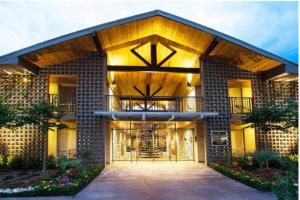 a house with a large front door with a balcony at Stylish Galleria Condo 2BR 2BA Saltwater Pool Marquee Uptown in Houston