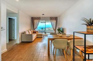 a living room with a couch and a table at Isea & Sun Calaceite in Torrox Costa
