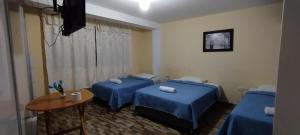 En eller flere senge i et værelse på ElOlympo