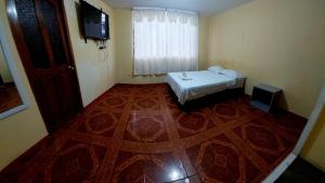 En eller flere senge i et værelse på ElOlympo