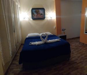 En eller flere senge i et værelse på ElOlympo + 4 billeder