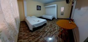 En eller flere senge i et værelse på ElOlympo