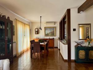 a living room with a table and a dining room at Casa Annie in Collbató