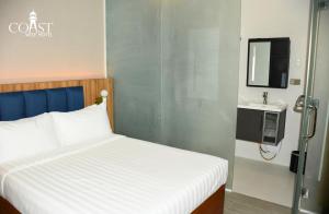 Coast Wise Hotel Dumaguete客房内的一张或多张床位