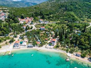 an aerial view of a beach with a resort at Apartments Cypress Sea Cove - Comfort Studio Apartment with Balcony and Sea View A1 in Slano