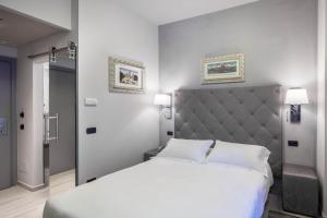 Postel nebo postele na pokoji v ubytování Hotel Moderno