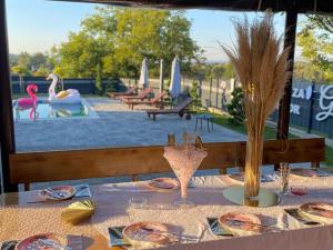 a table with plates of food on top at Holiday Home Gra ec - Three Bedroom Holiday Home with swimming pool in Zagreb