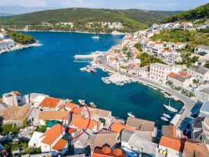 an aerial view of a town with boats in the water at Apartments Sonja - Studio Apartment ST in Pučišća