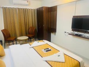 TV a/nebo společenská místnost v ubytování Habitat Inn