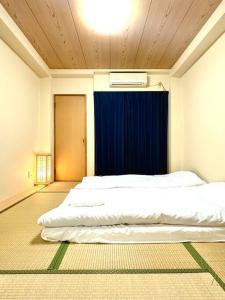 Llit o llits en una habitació de 201号室花園町,萩之茶屋駅步行2分専用バスルームアクセス便利 32 fotos més