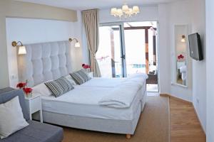 Łóżko lub łóżka w pokoju w obiekcie Hotel Delfin