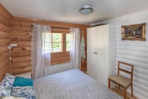 Ліжко або ліжка в номері Poukama Cottage Päijätsalo